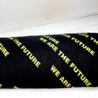 Ткань футер петля 1,8м желтая надпись на черном