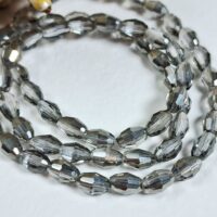 Скло овал 4*6мм 60-66штук димчастий 32662