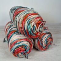 Сток акрил меланж 100г/190м червоно-джинс-молочний